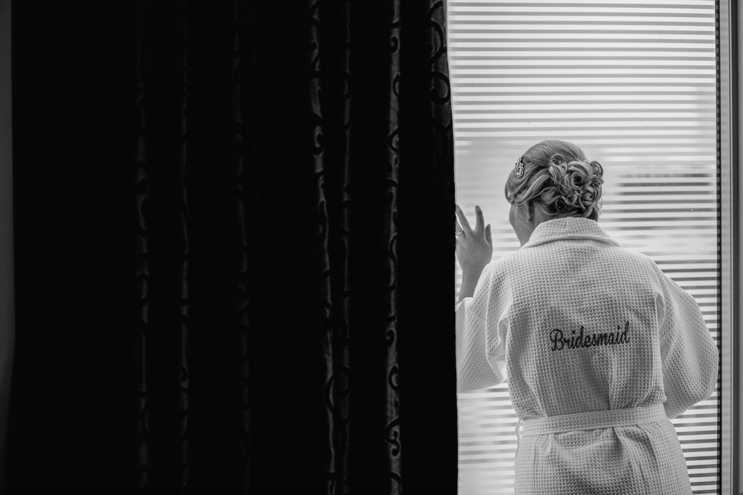 bridesmaid staring out window
