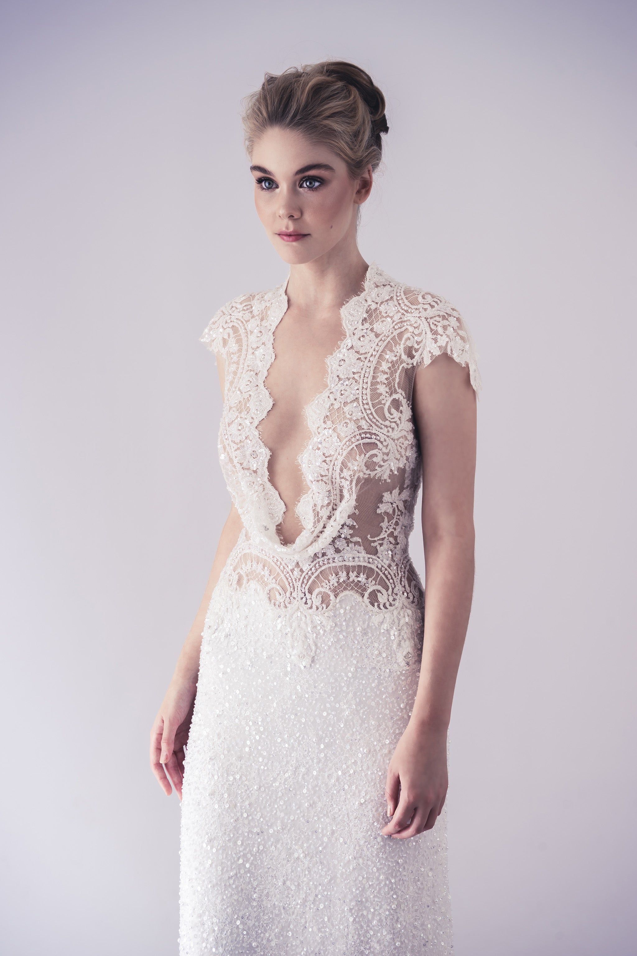 beaded lace wedding dress with cap sleeves and v-neckline