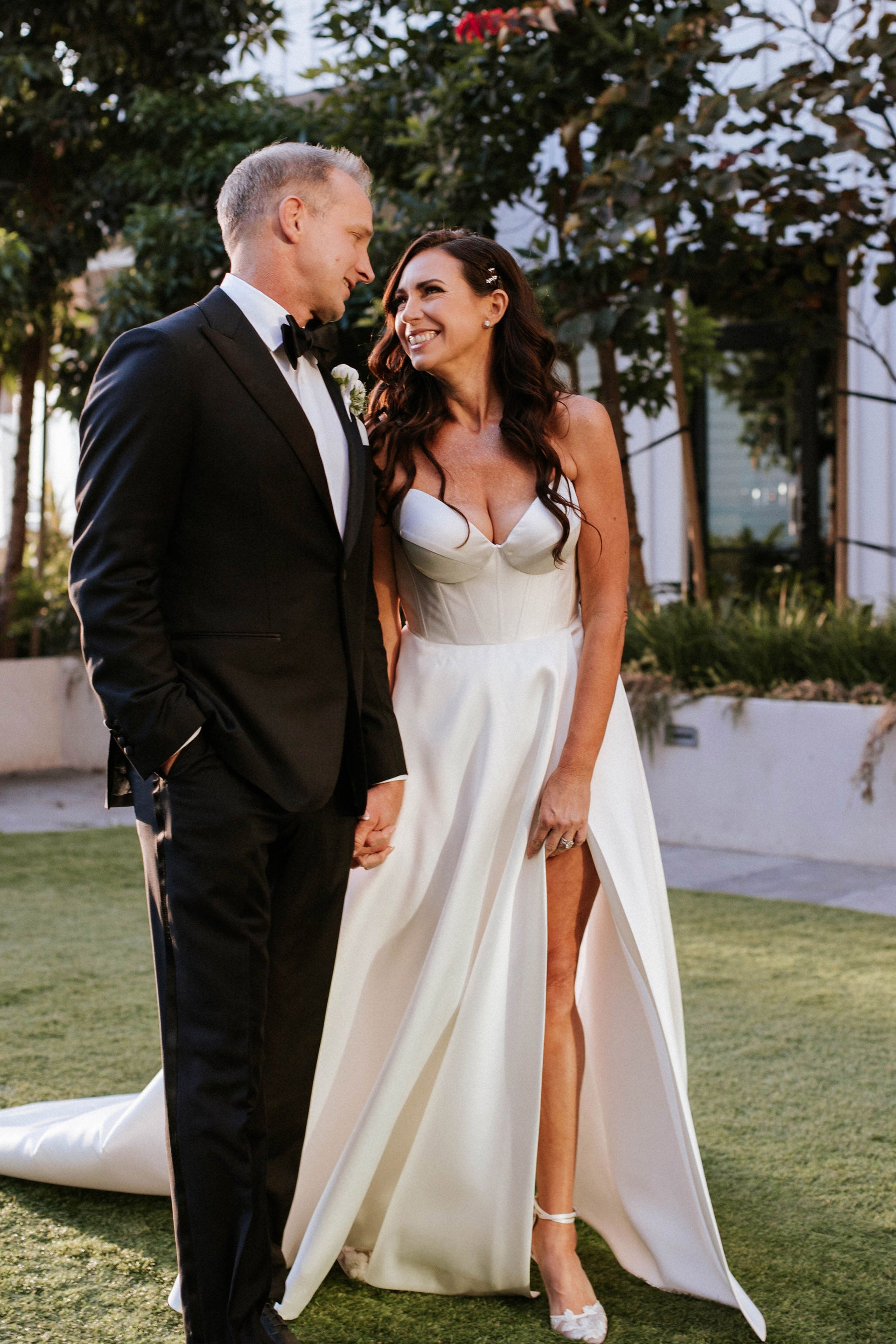 bride and groom on wedding day in gown and suit