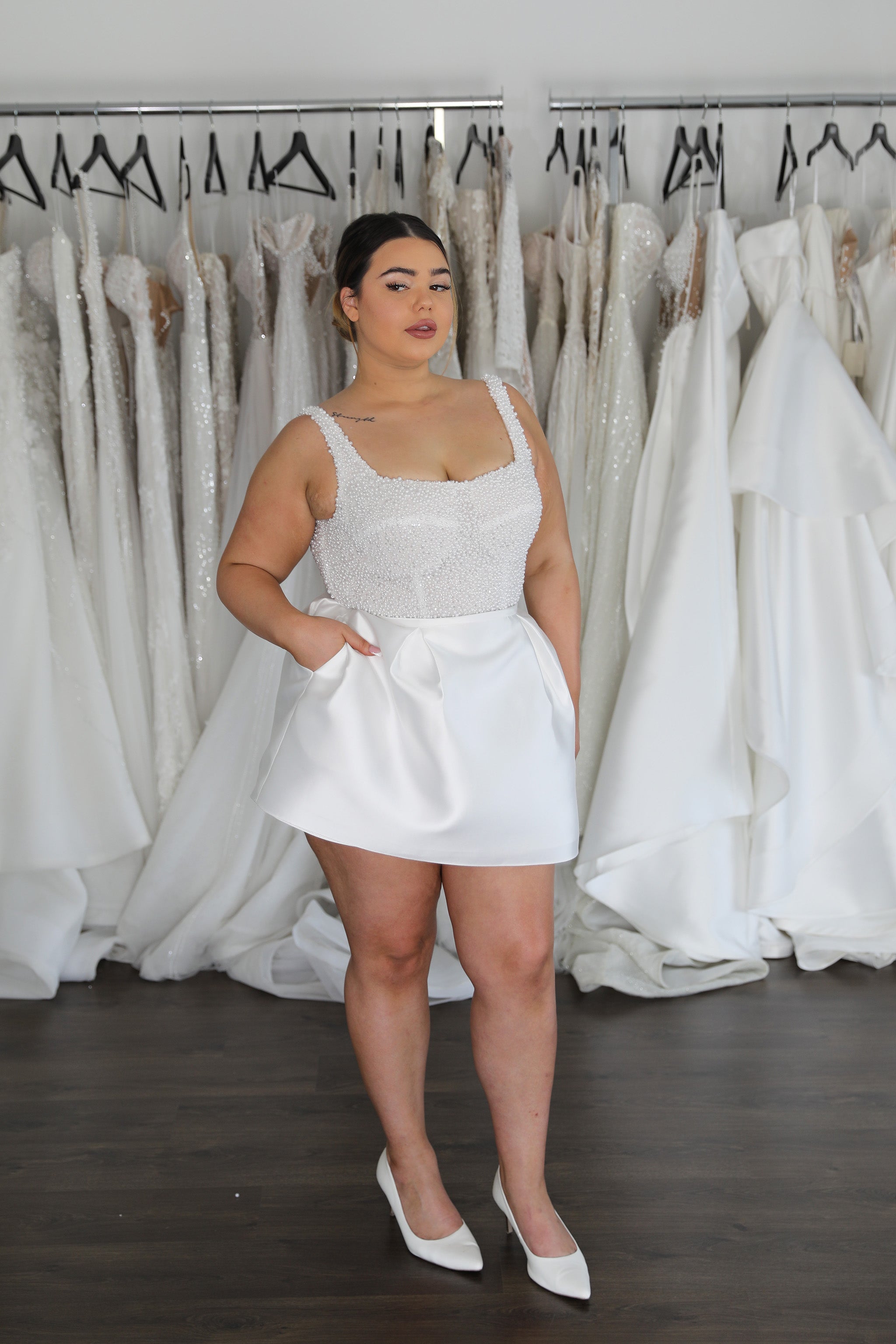 bride in bridal mini skirt and pearl top