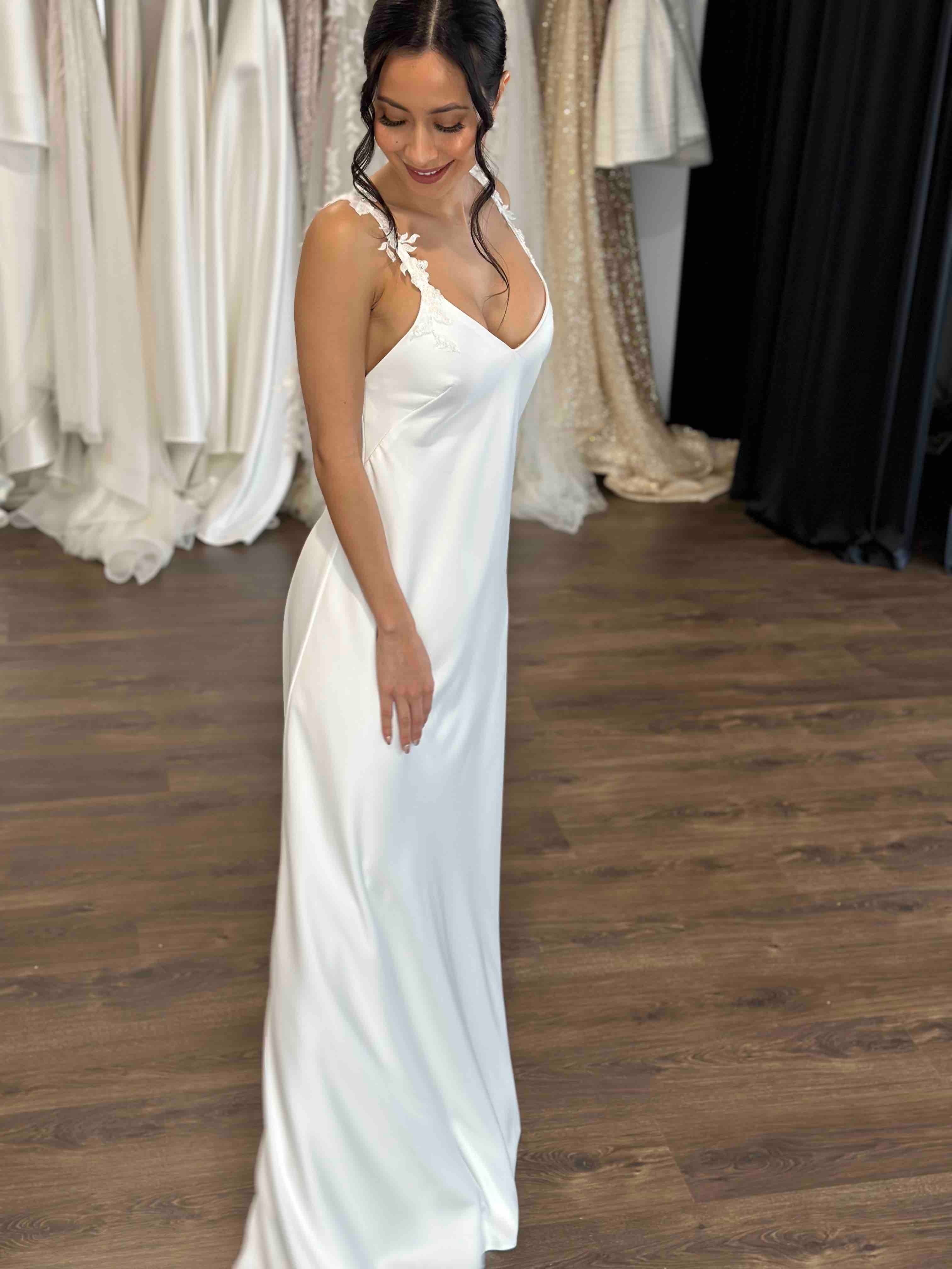 bride posing in bridal reception gown