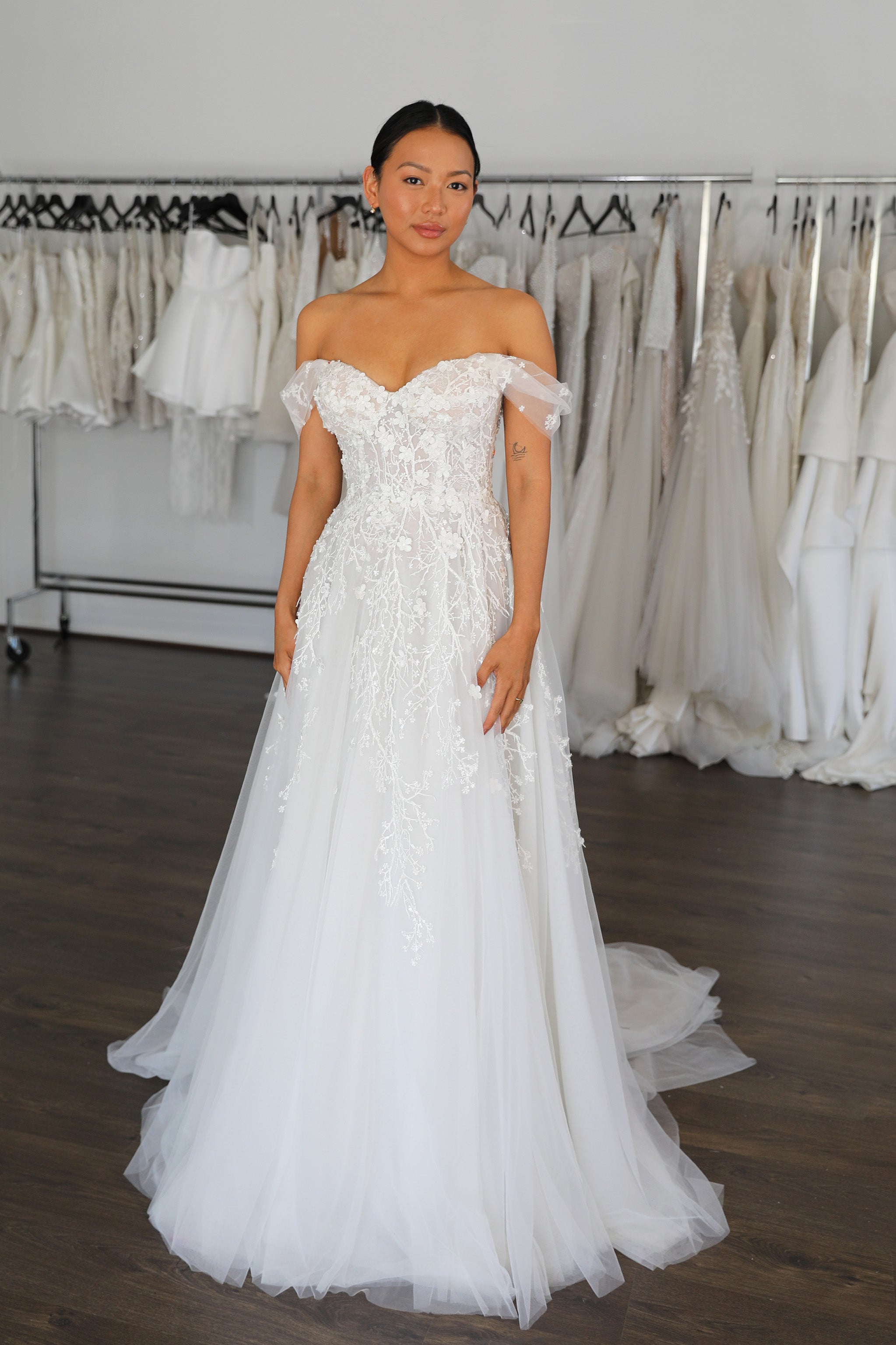 bride wearing romantic white cherry blossom lace gown