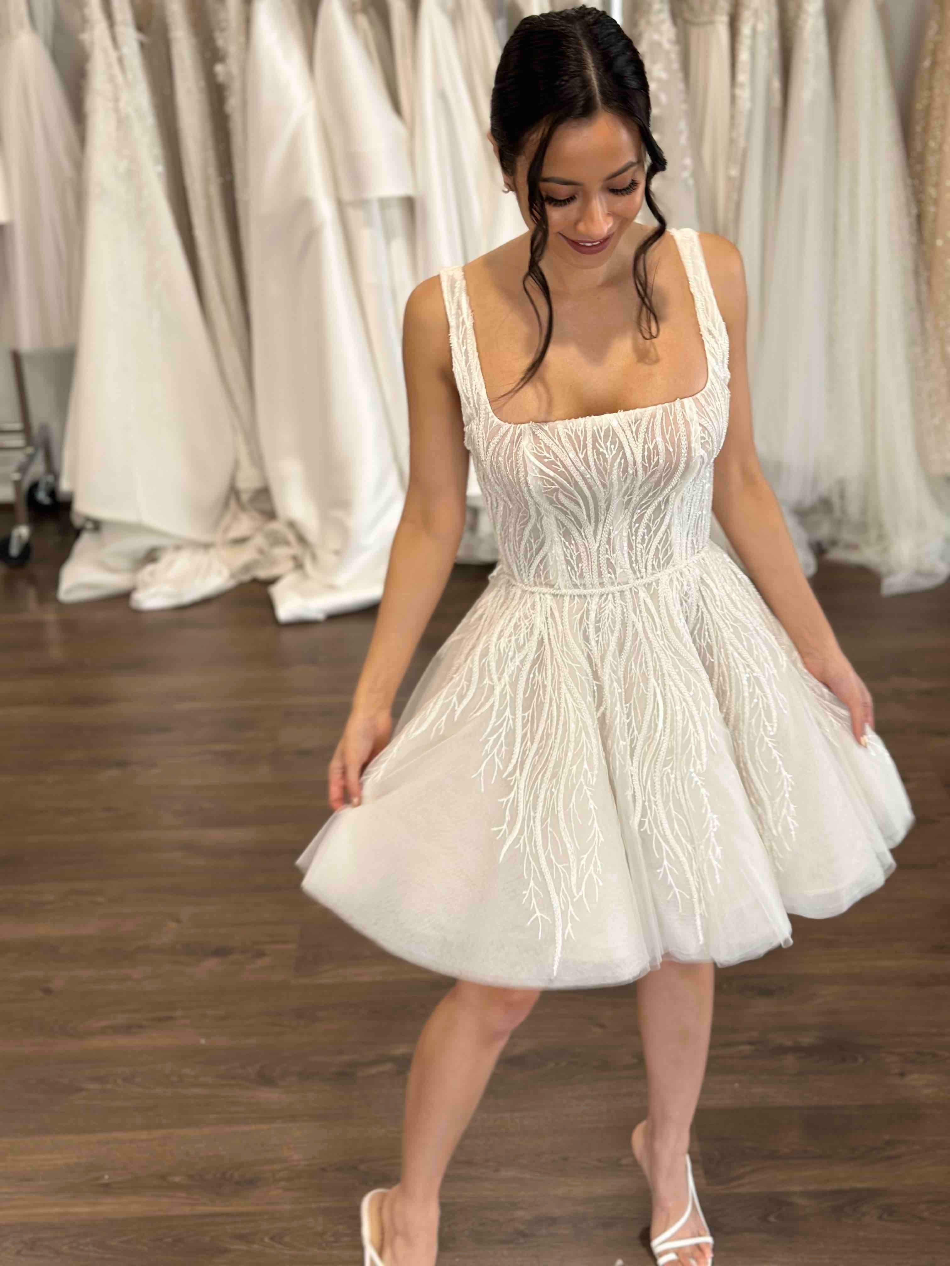 bride wearing u-neck mini gown