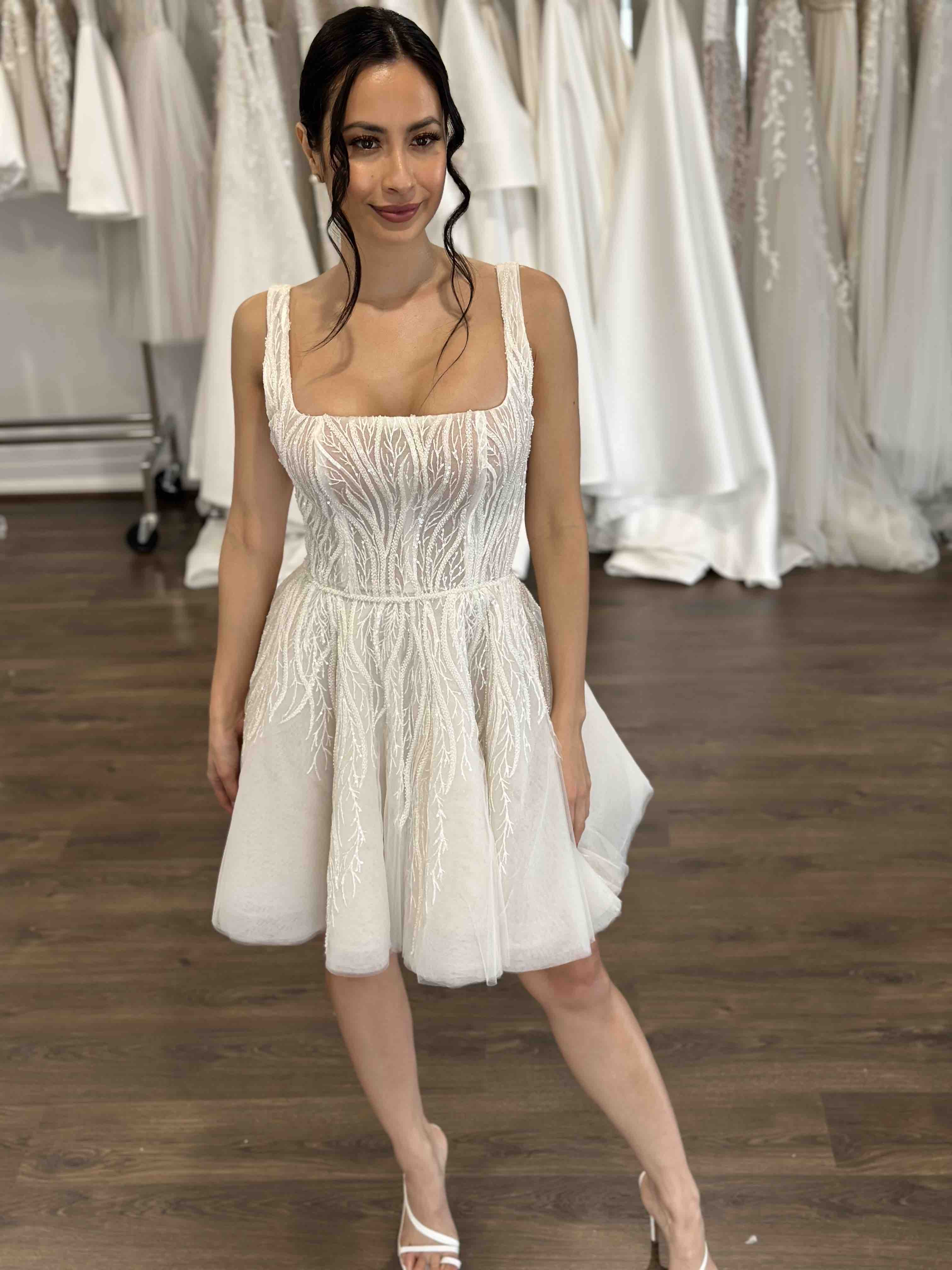 bride wearing u-neck vine lace mini dress