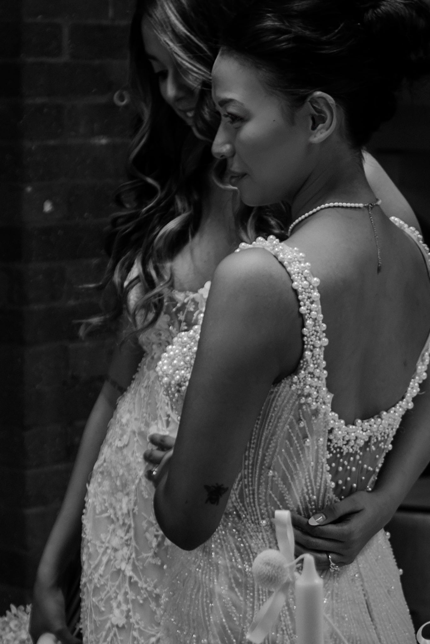 brides embrace on their wedding day