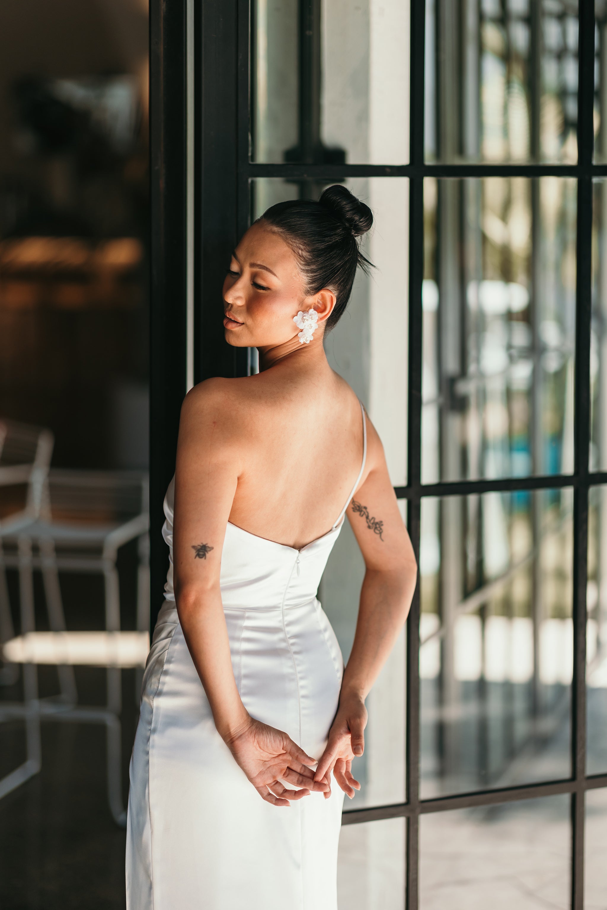 bridesmaid wearing white one shoulder gown