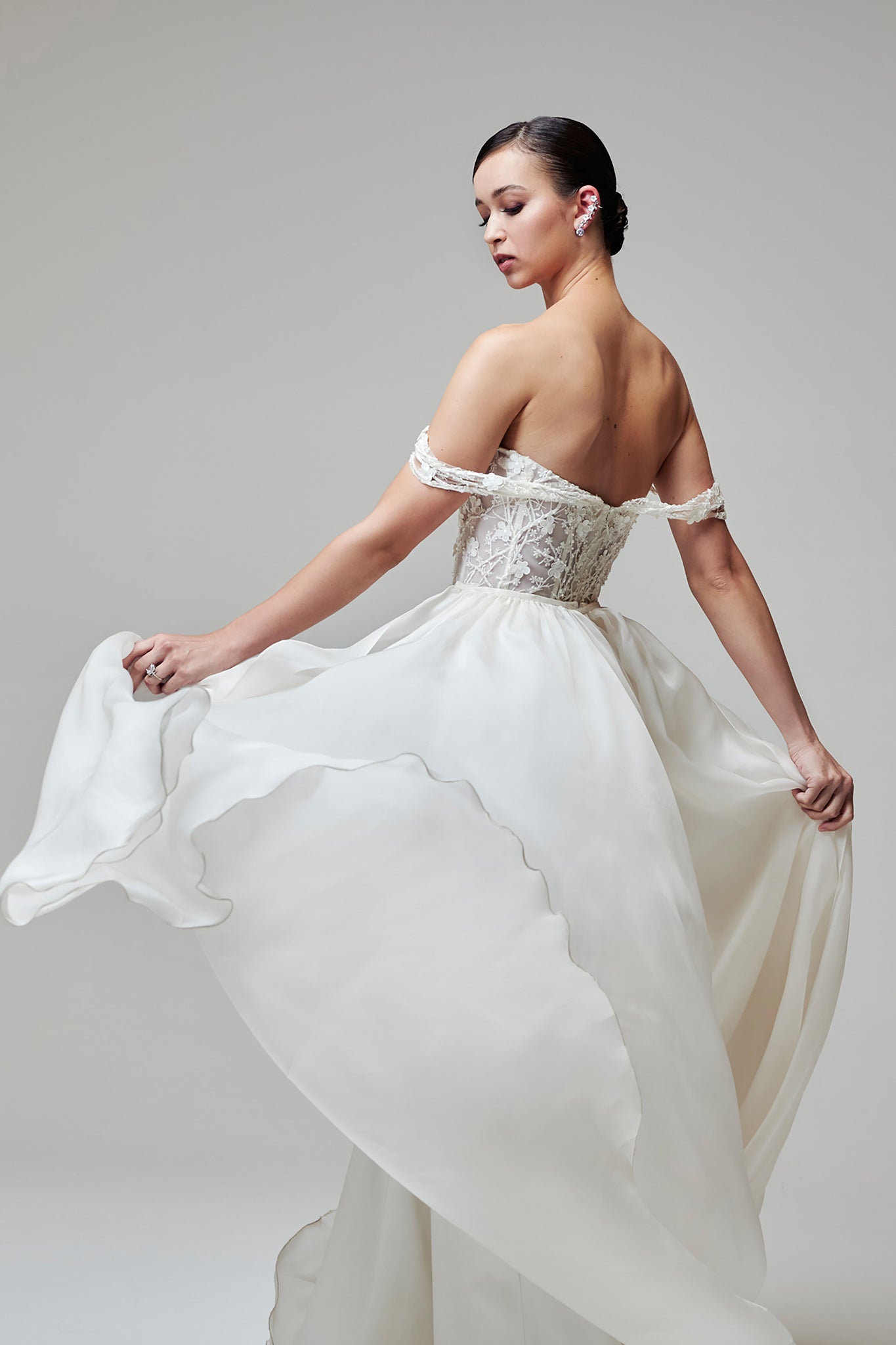 flowing white skirt and floral appliqué corset top