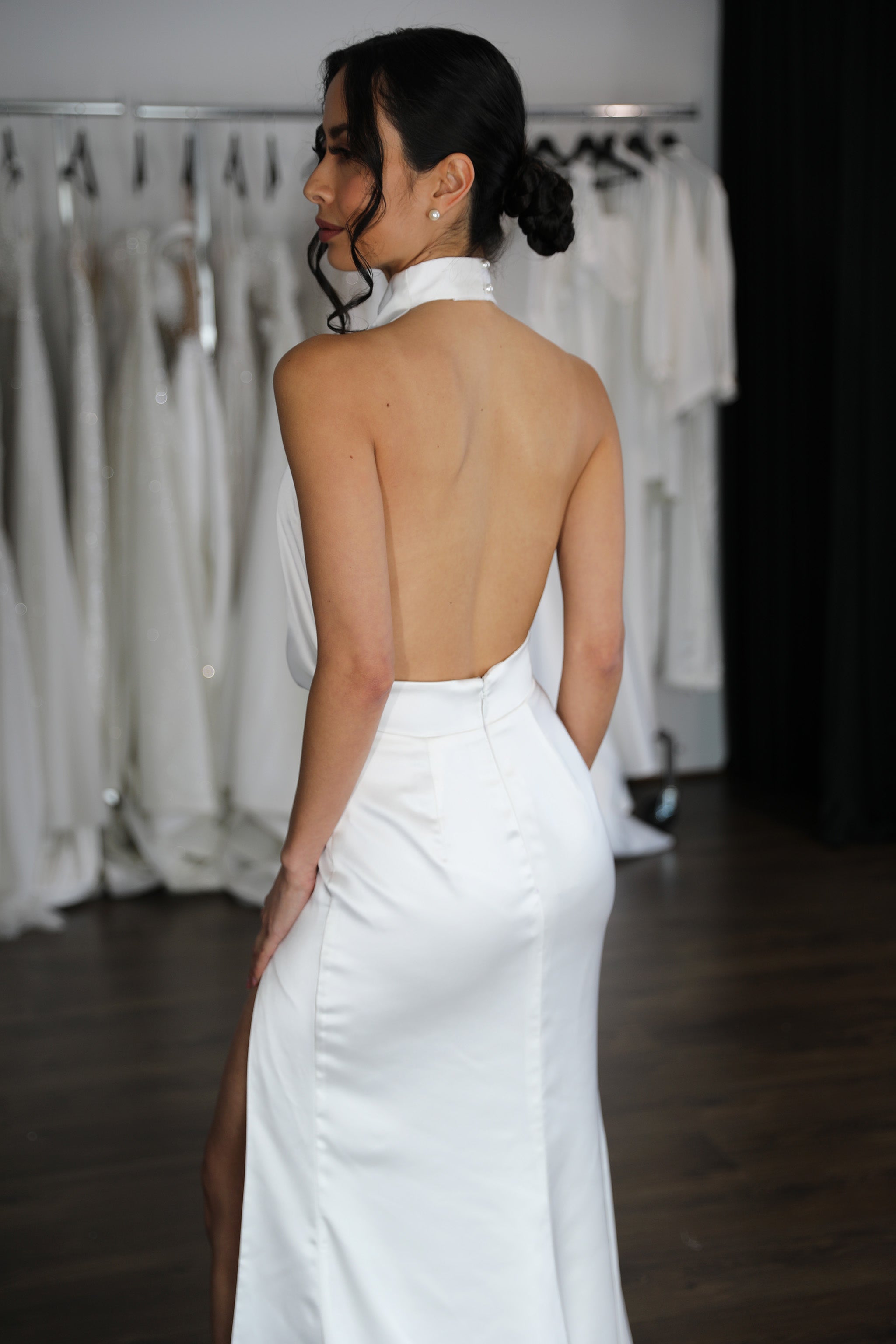 low back halter neck wedding reception dress on woman's body