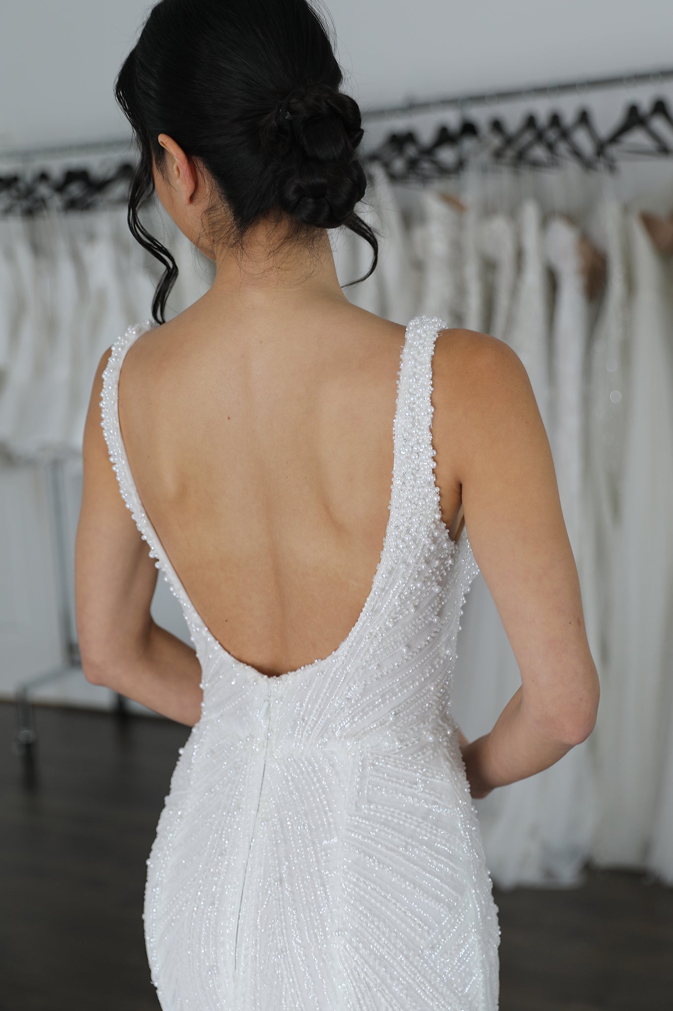 low u-back bridal gown with pearl details