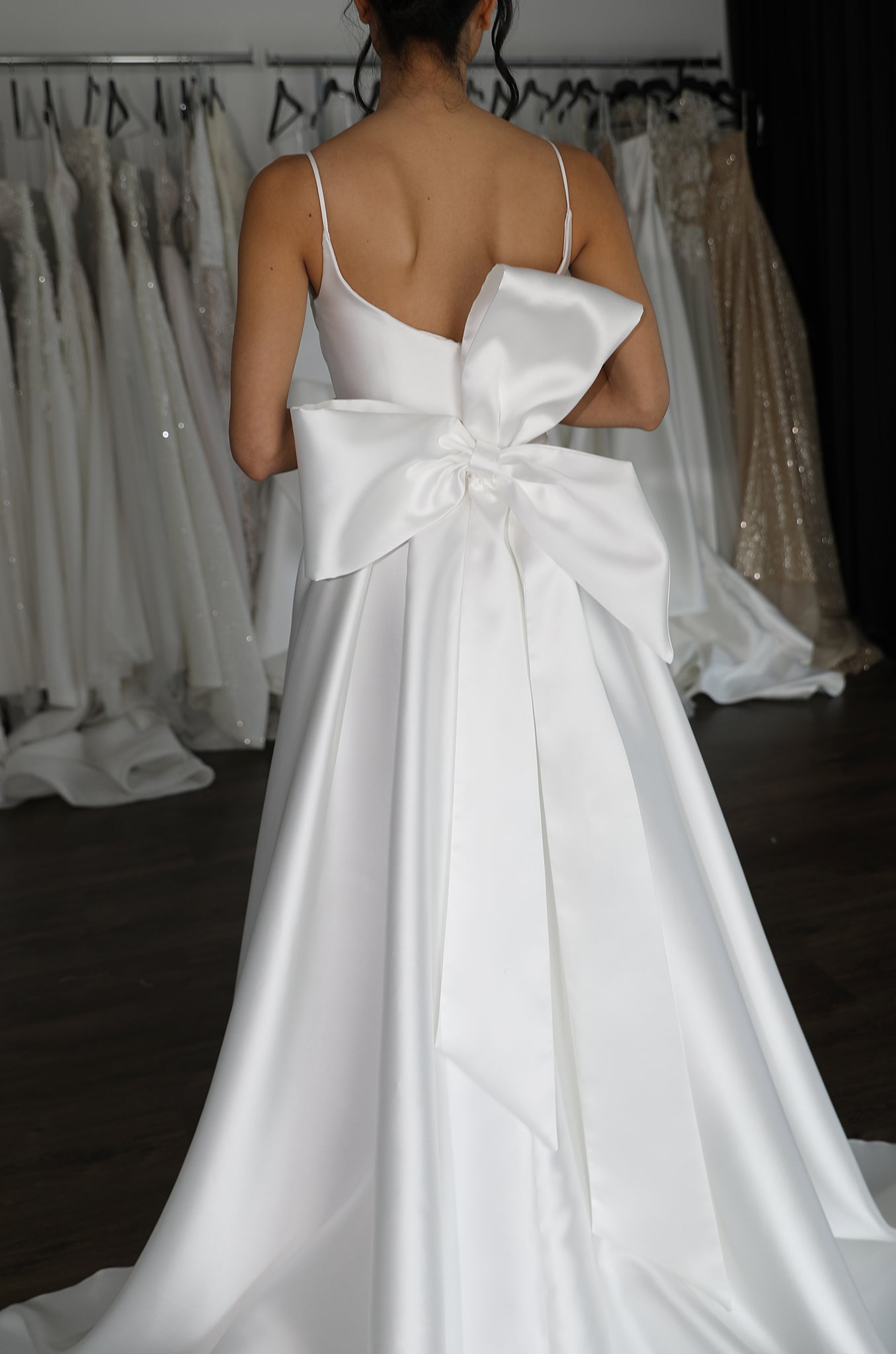 mikado wedding dress with thin straps and giant knotted bow