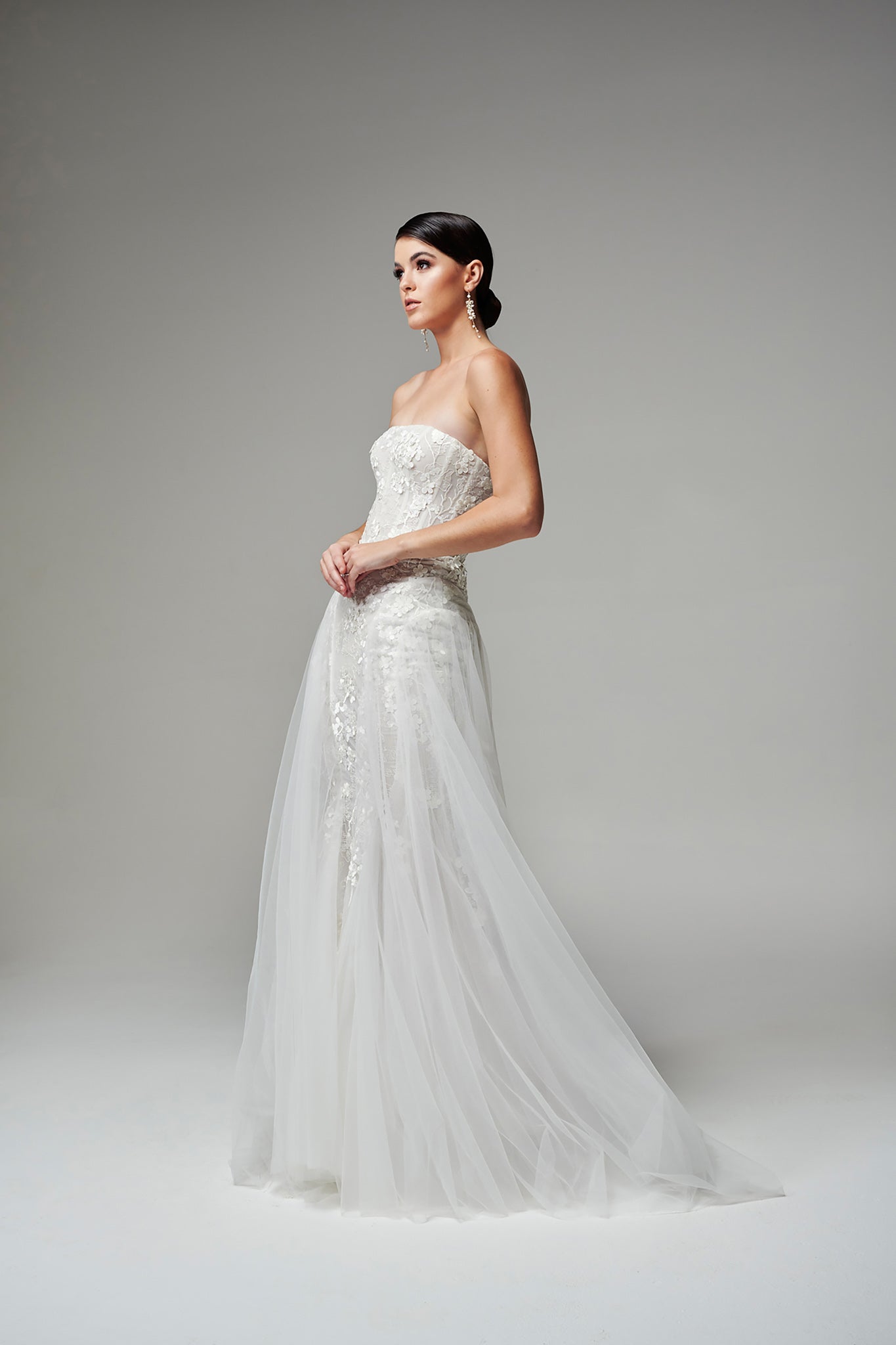 model posing in floral lace wedding dress