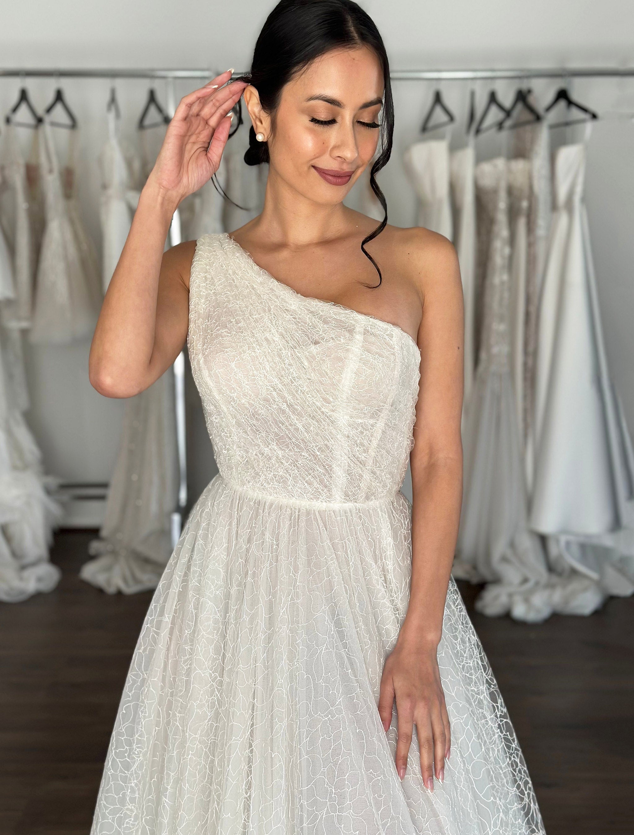 one shoulder bridal gown with flowing skirt