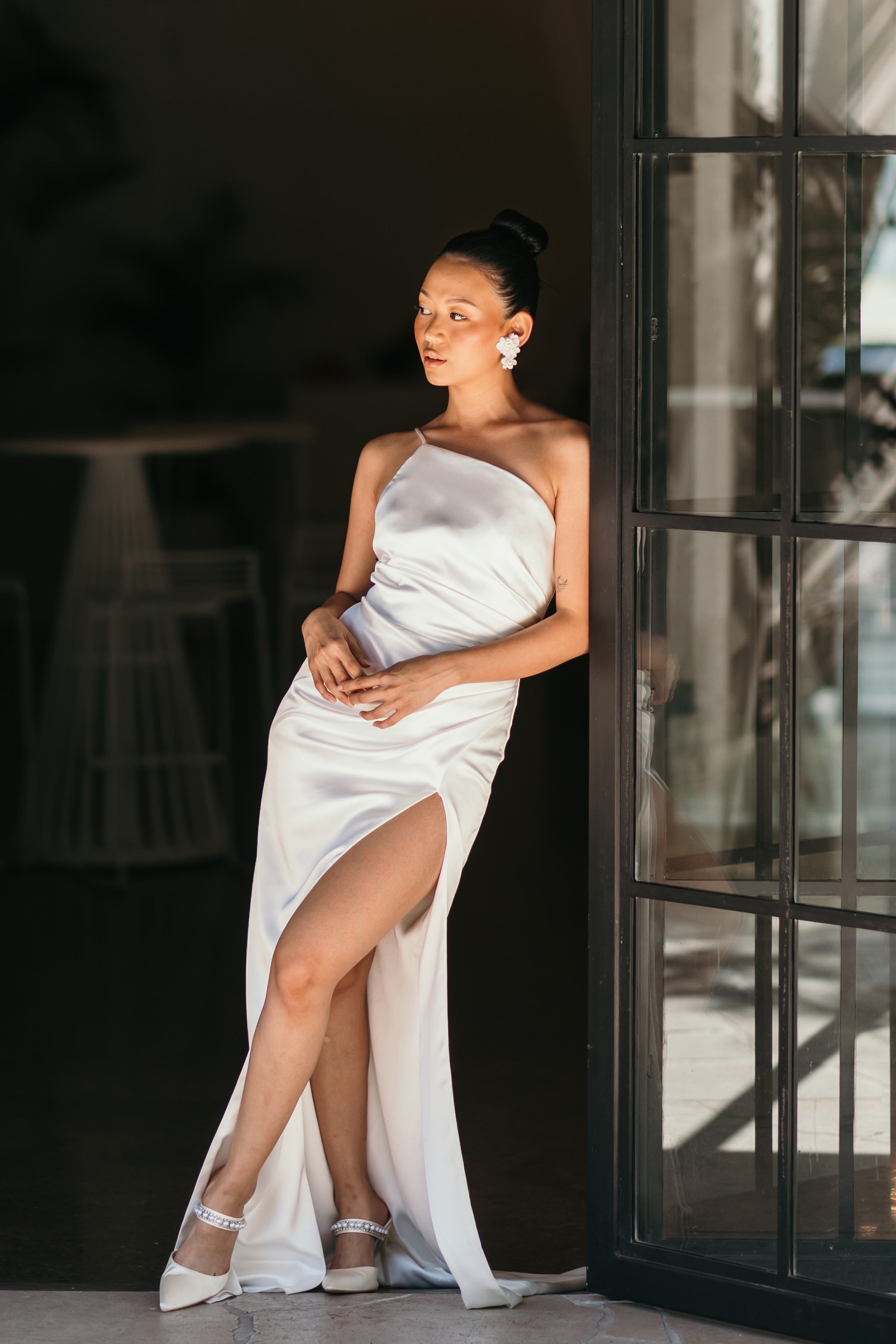 one shoulder bridesmaid gown with spaghetti strap and high thigh split