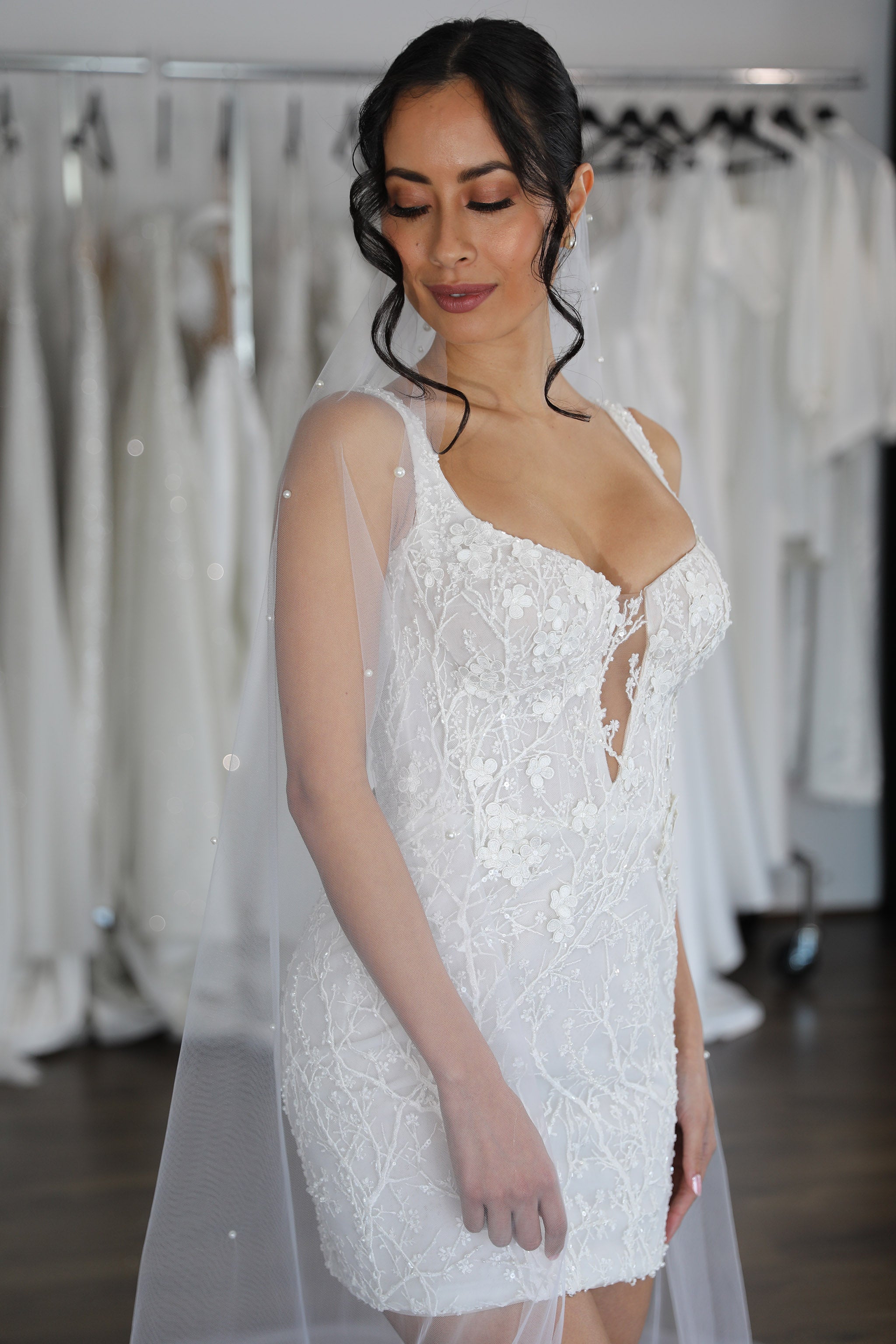 pearl veil and floral lace mini dress on bride
