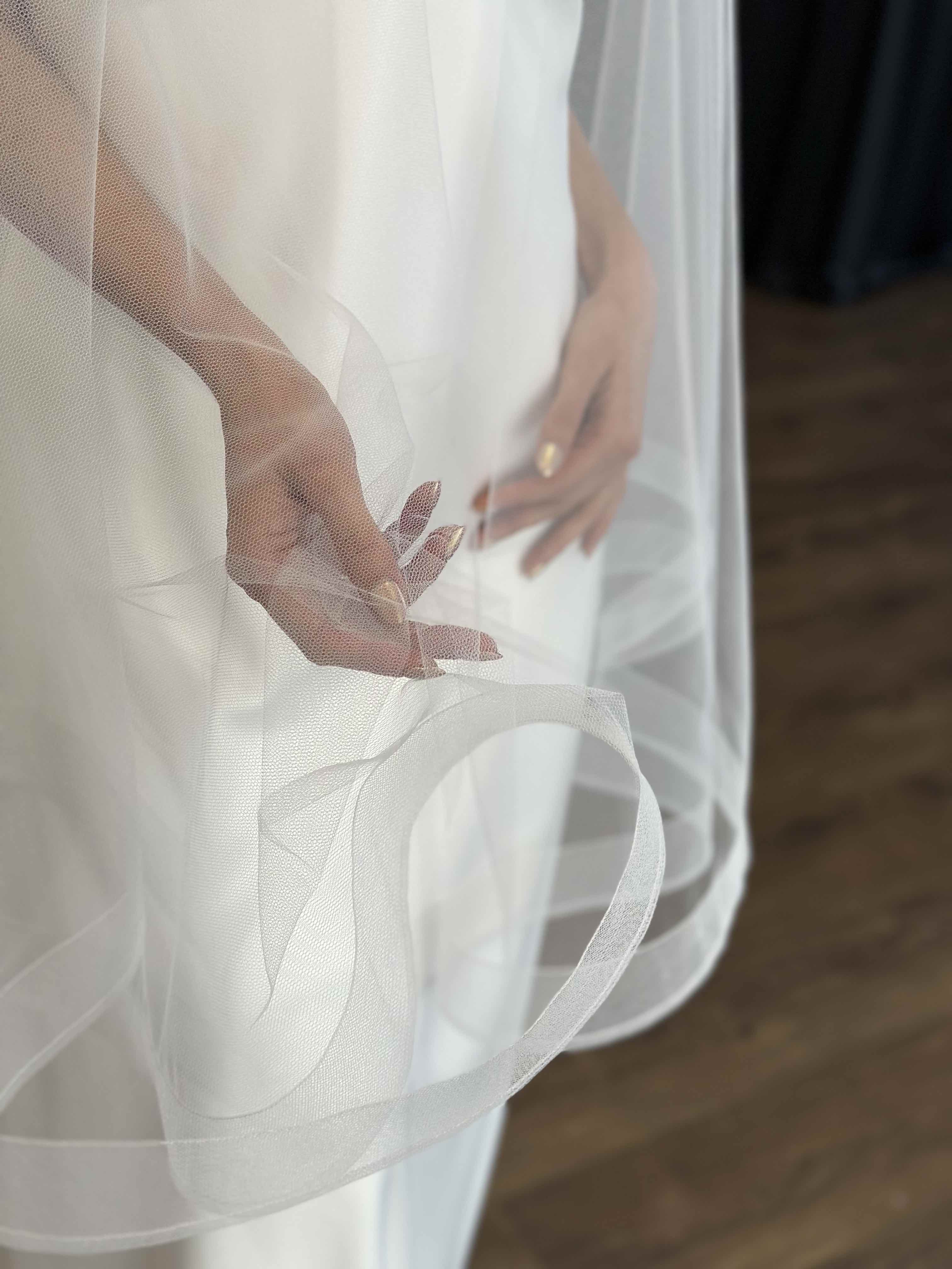tulle veil with crinoline hem on woman's body