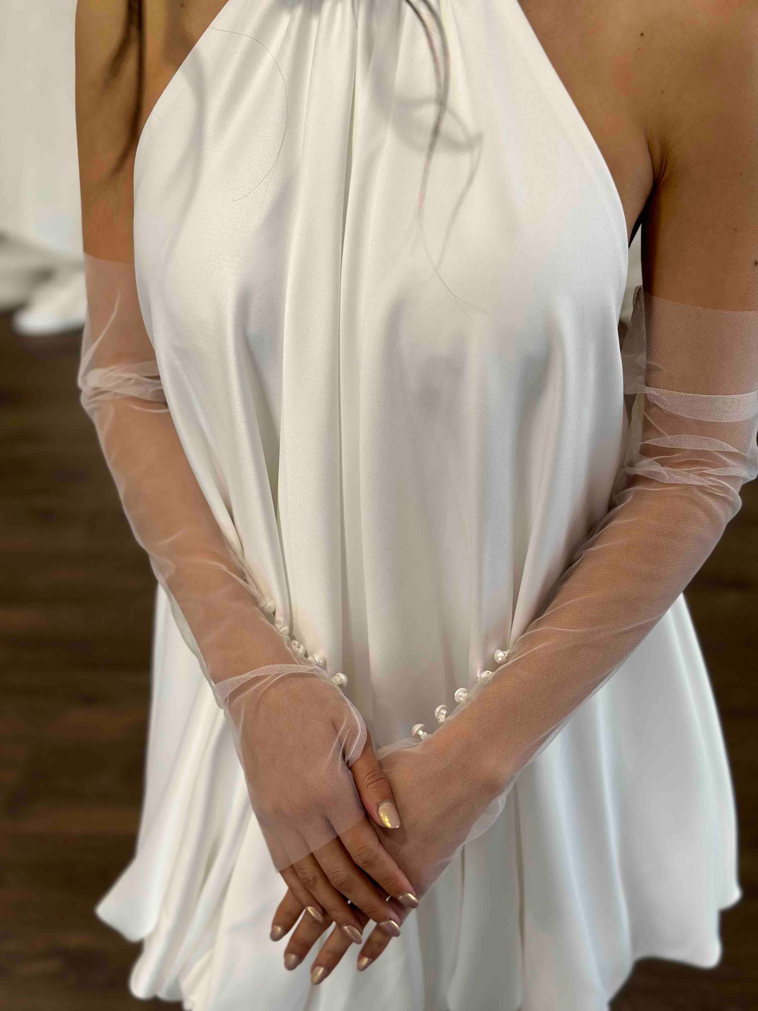 white halter neck slip dress and tulle bridal gloves