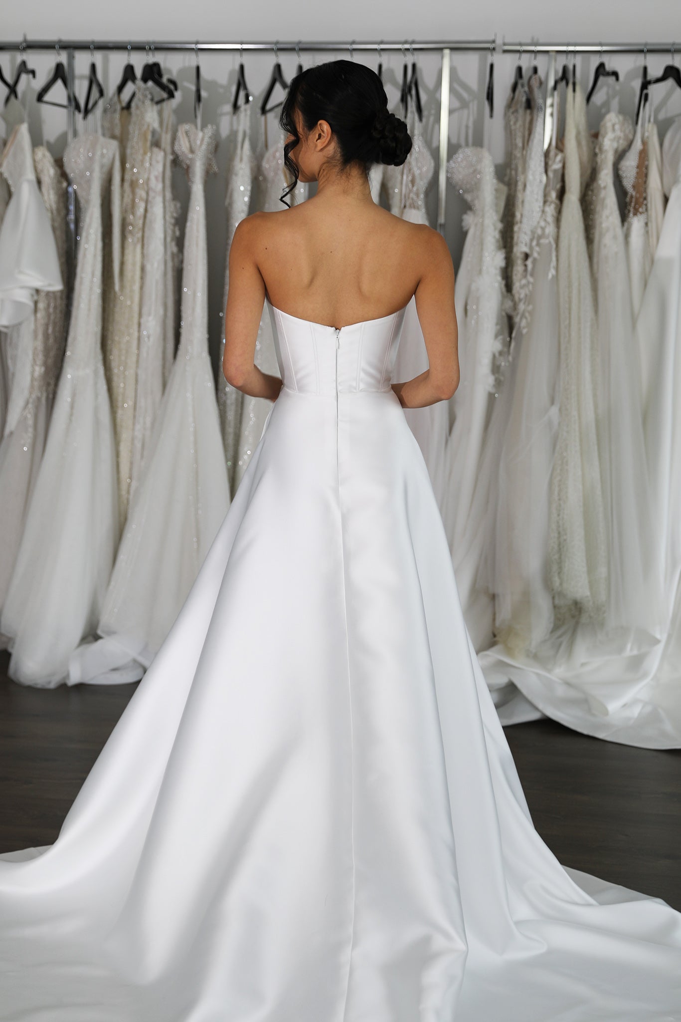 white mikado bridal gown with curved back and long train skirt