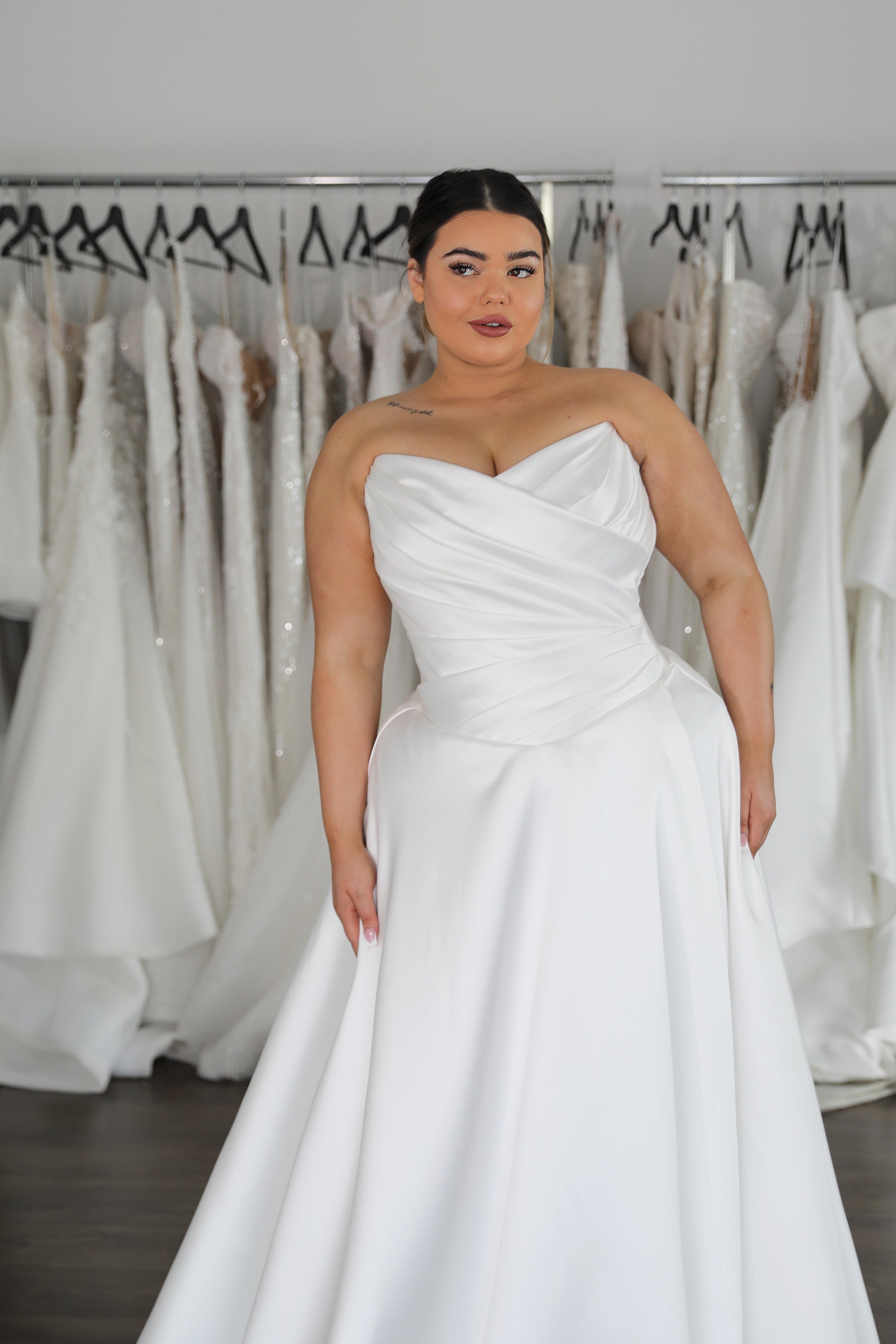 woman wearing drop waist twist top mikado wedding gown