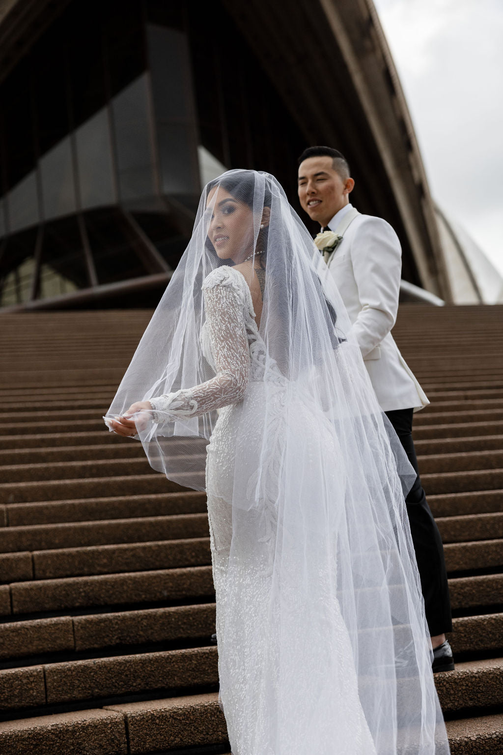 bride wearing full length veil with blusher