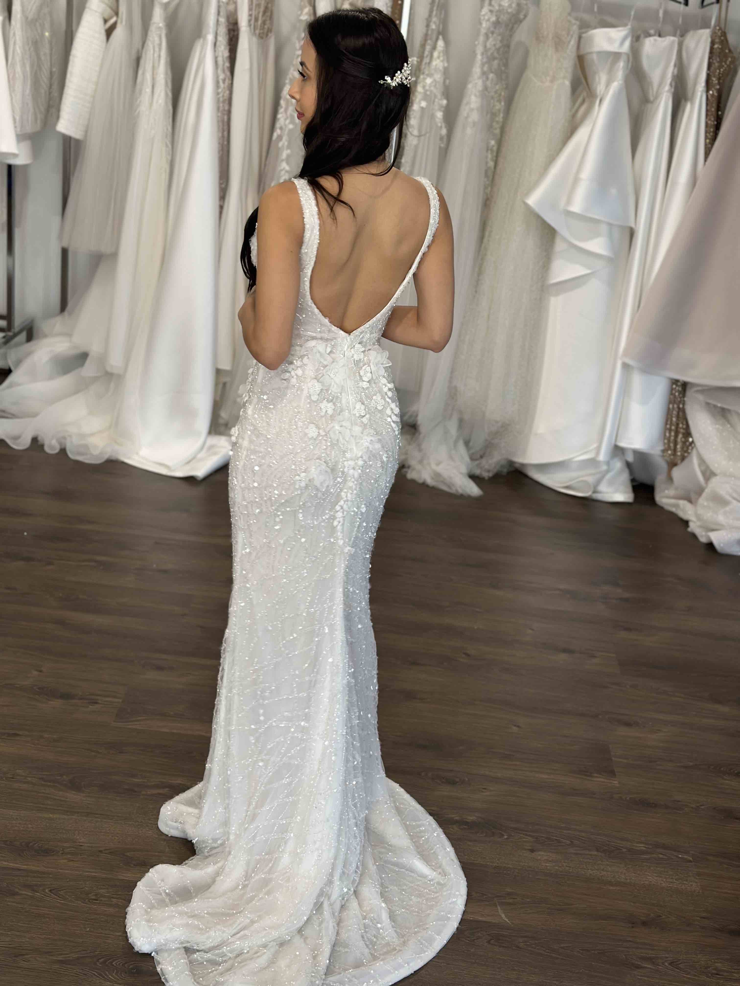 bride wearing low u-back cut wedding gown