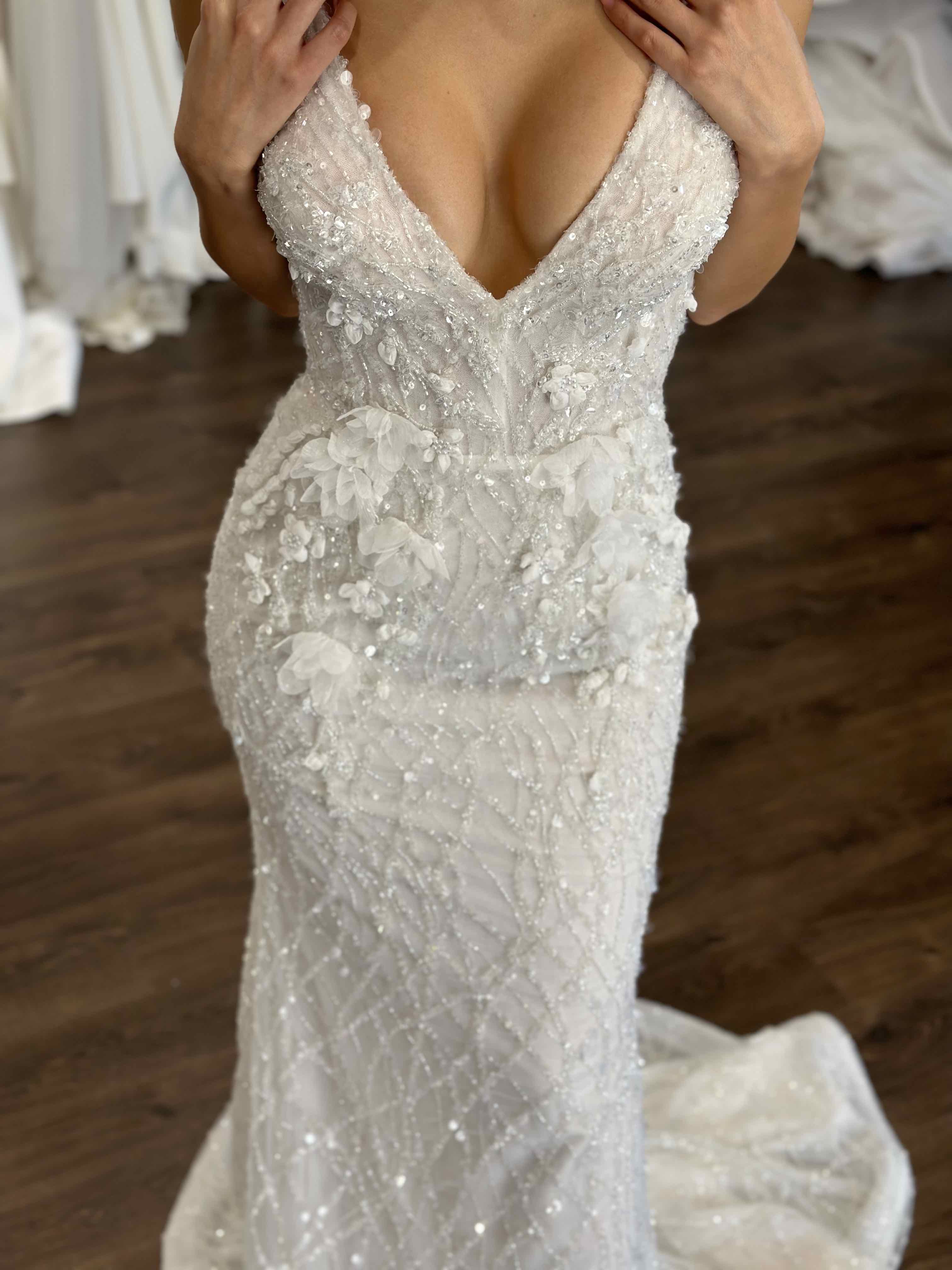 deep v-neck wedding dress on bride
