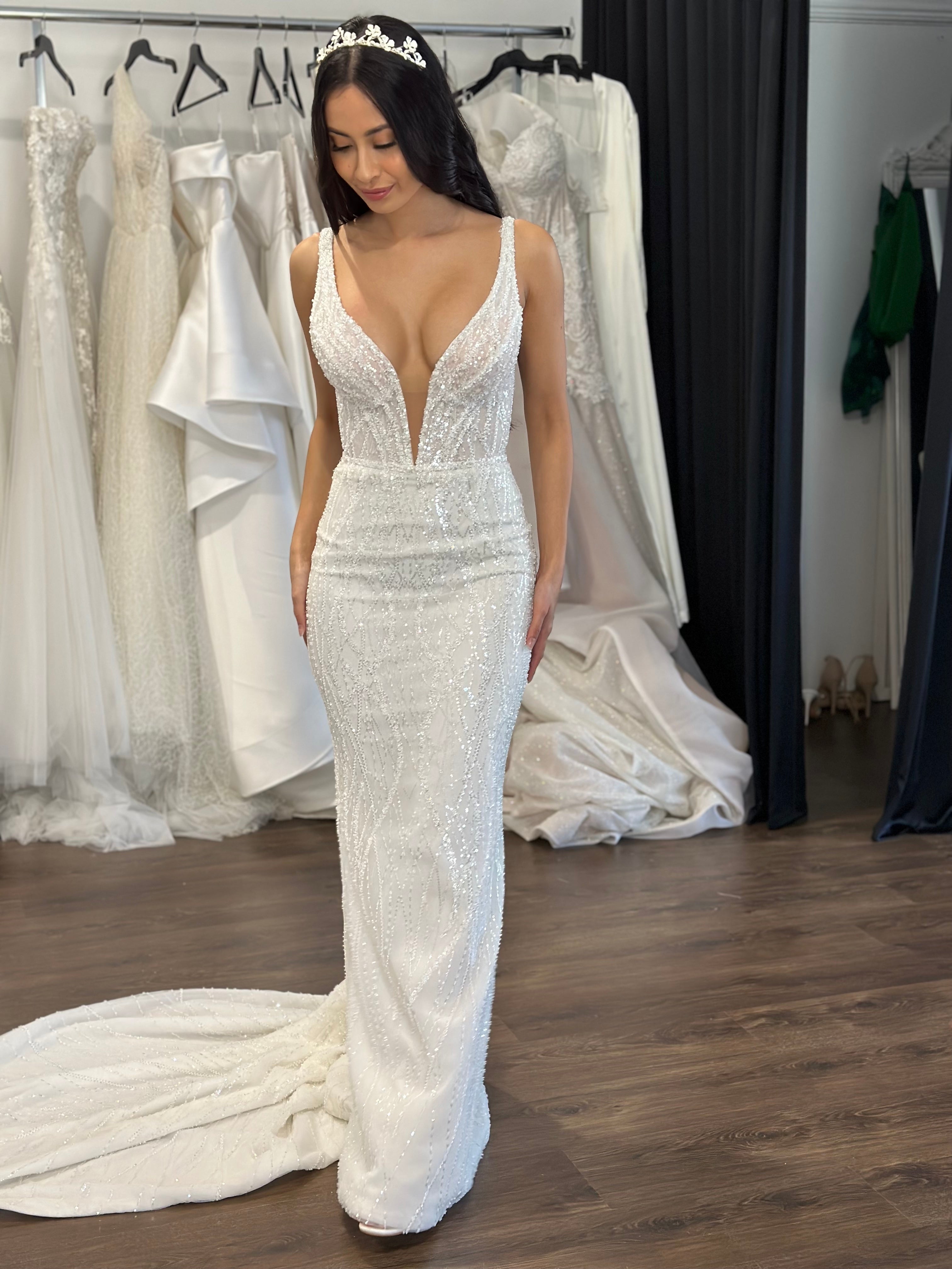 v-neck wedding gown on bride wearing crown at Brisbane studio