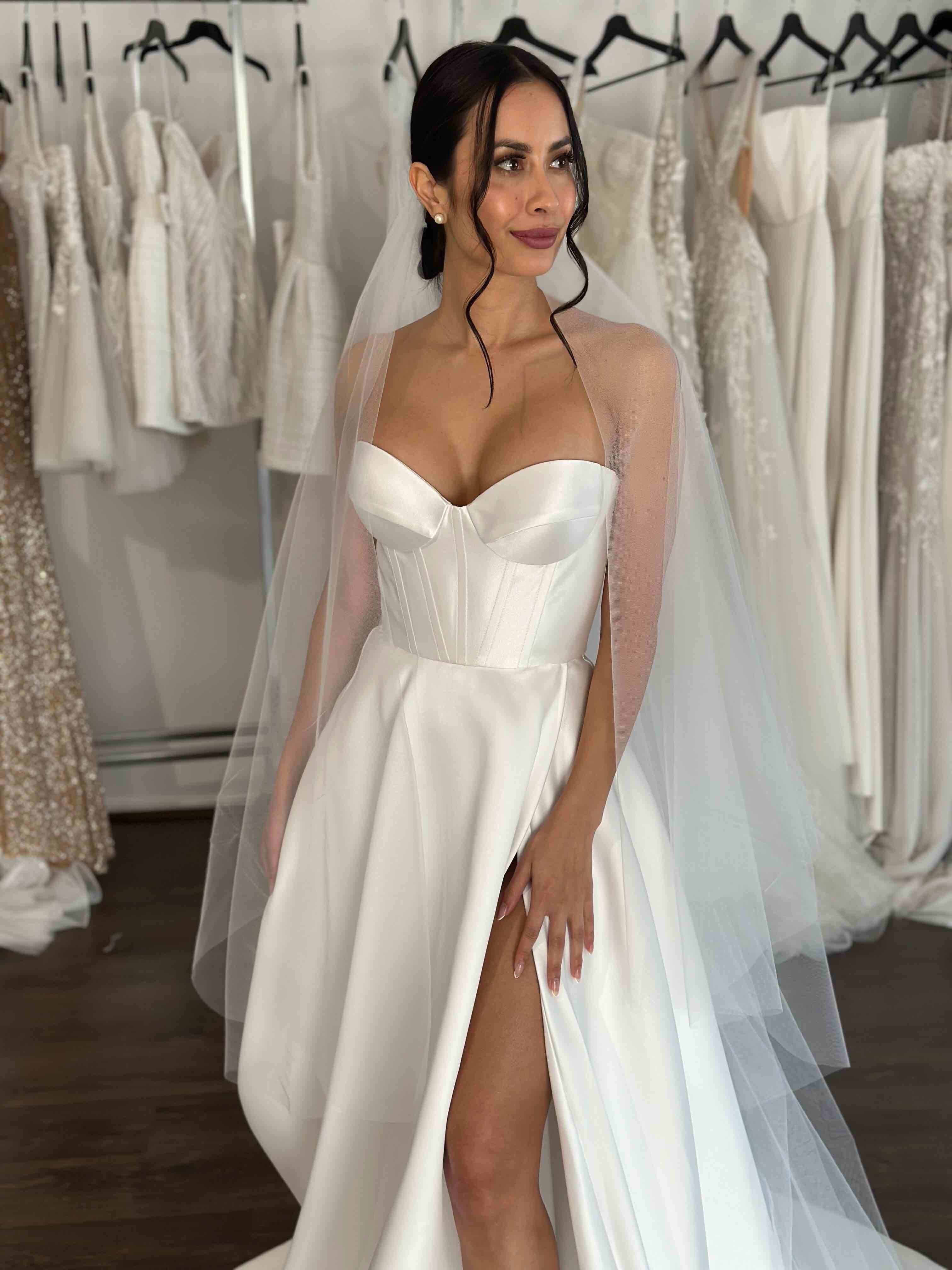 white mikado gown with high thigh split on woman's body