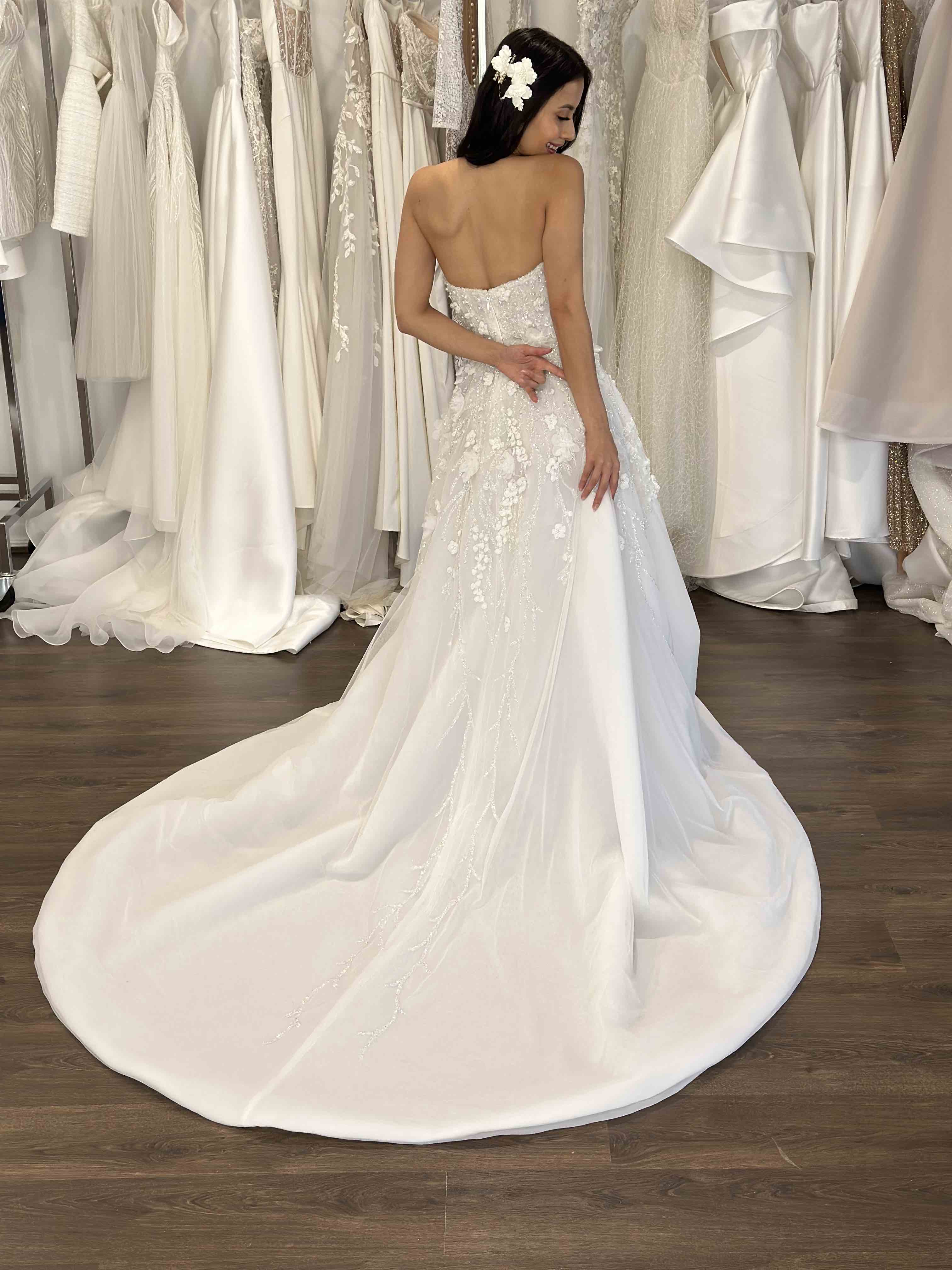 woman with flowers in her hair wearing couture wedding gown