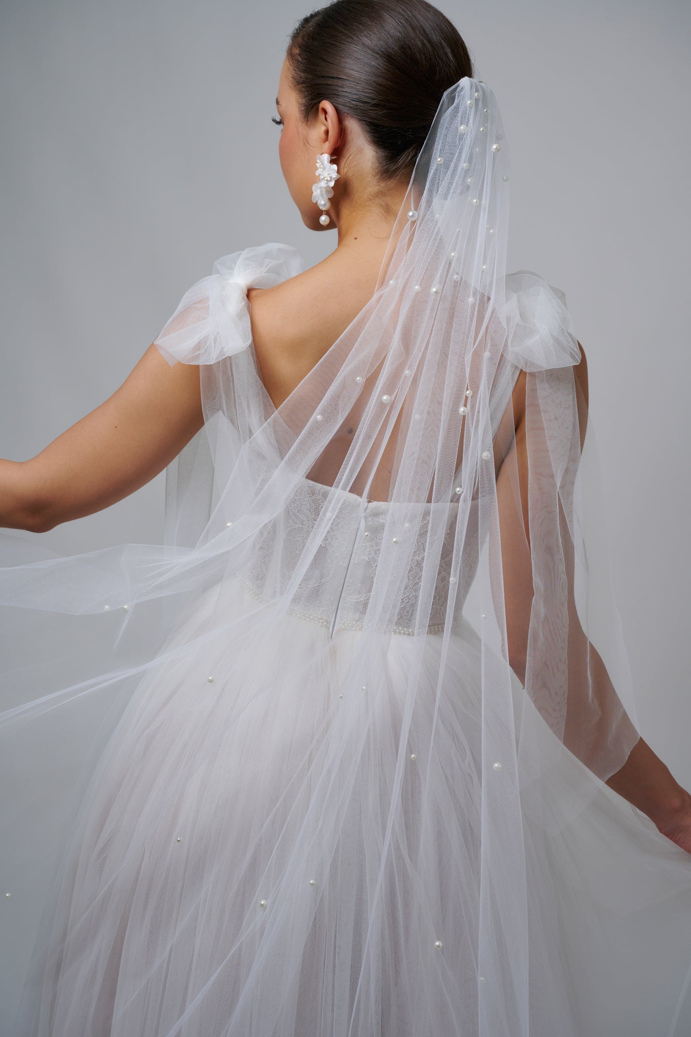 woman with pearl embellished veil in her hair