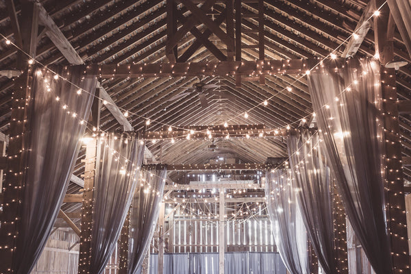 archway at wedding venue covered in lights