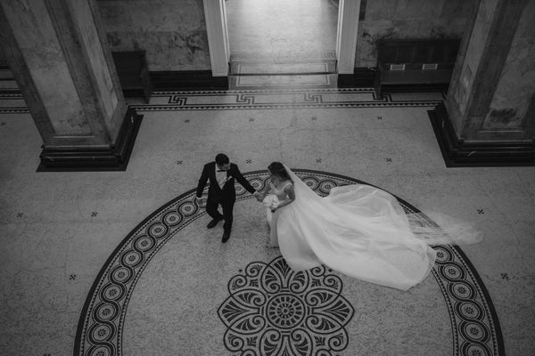 bride and groom circling a marble courtyard