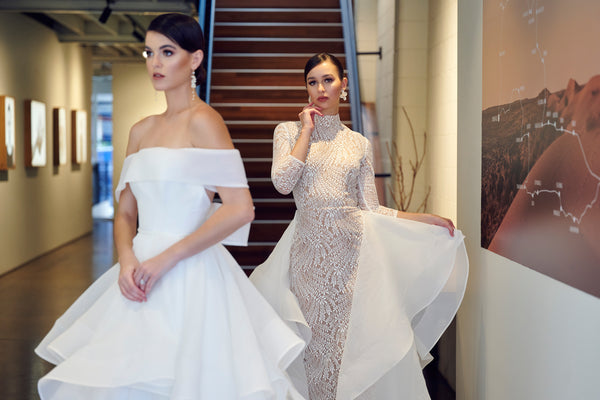 brides wearing wedding dresses in front of stairway in Brisbane studio