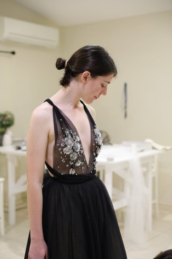 brunette woman wearing black tulle formal dress with lace details