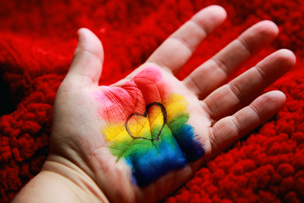 hand-with-pride-flag-and-love-heart-painted-in-palm