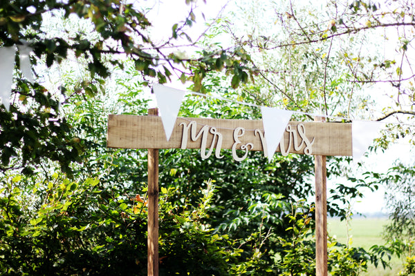 wooden sign with mr and mrs written on it