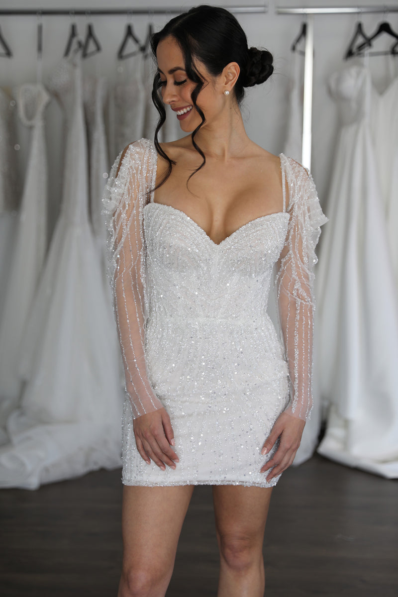 beaded mini gown on smiling bride