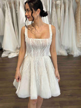 bridal mini with u-neck and flowing skirt on woman