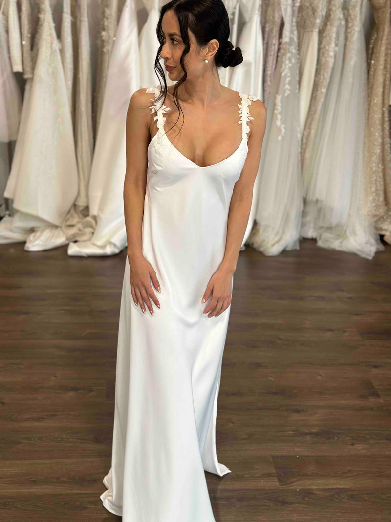 bridal slip dress worn by model in showroom