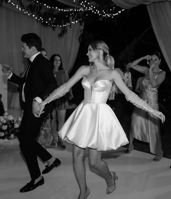 bride and groom dancing in wedding attire