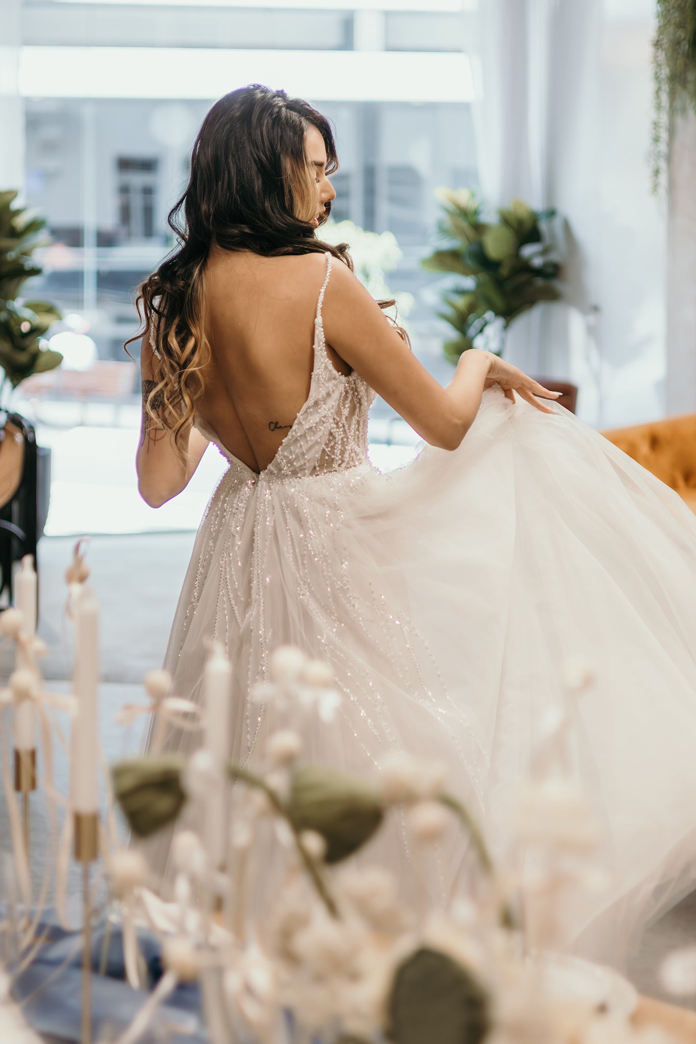 bride fluffing the skirt of her wedding dress