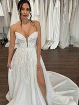 bride in beaded gown with high thigh split