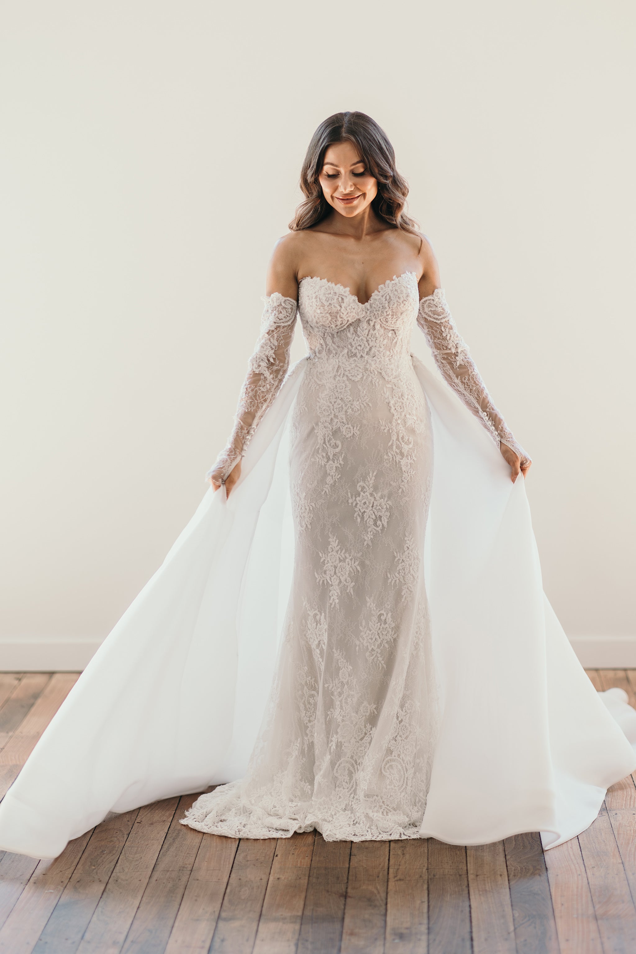 bride in beaded lace wedding gown with organza outerskirt