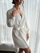 bride posing in her wedding morning robe