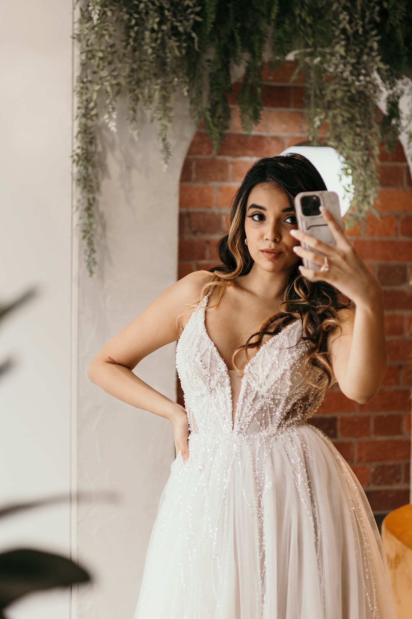 bride taking selfie in her wedding dress