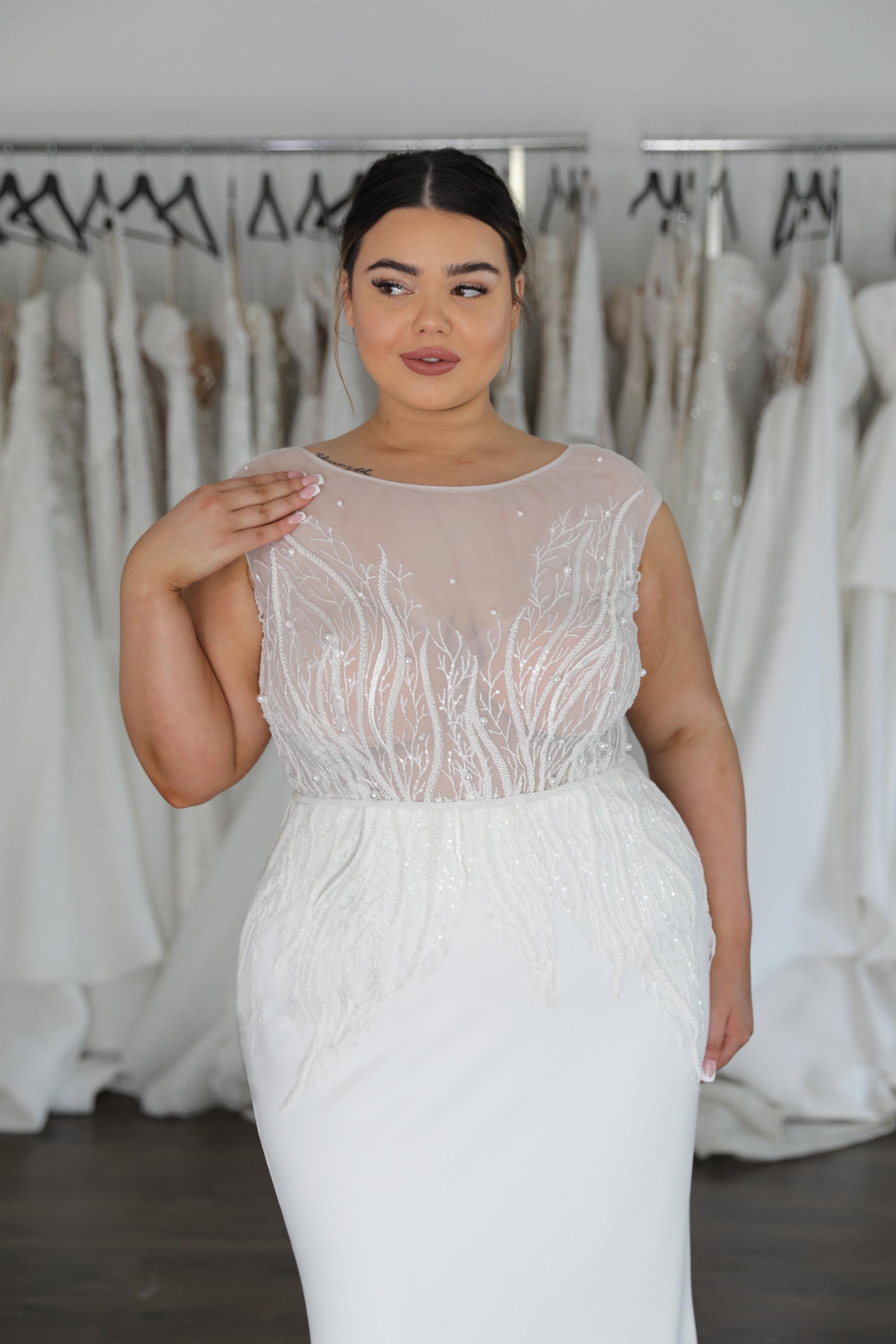 bride wearing fitted lace and crepe wedding dress