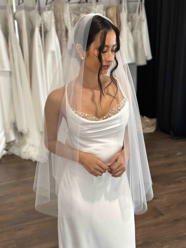 bride wearing pearl insert slip dress and veil