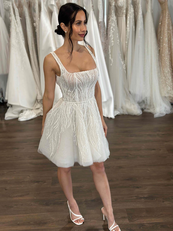 bride wearing reception mini dress made from vine lace and tulle