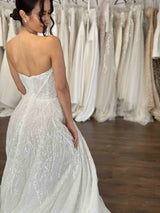 bride wearing strapless beaded wedding gown