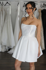 bride wearing strapless mini dress