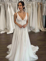 bride wearing v-neck lace wedding gown